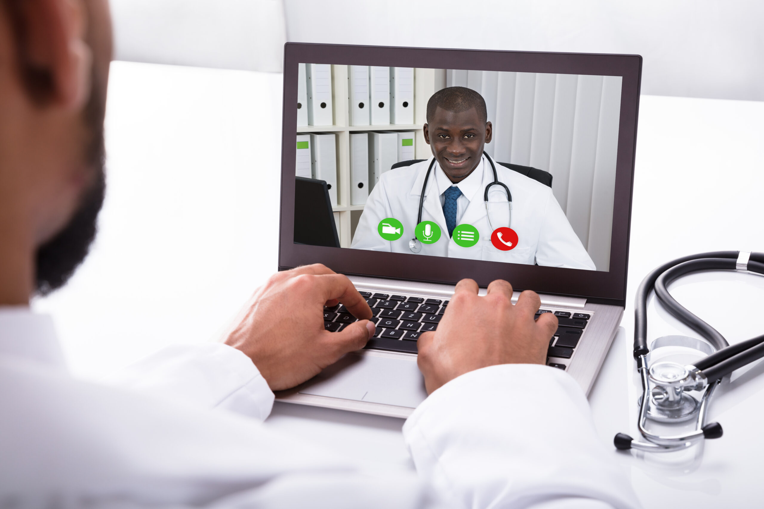 Professional south African Doctor seeing a patient on a zoom call